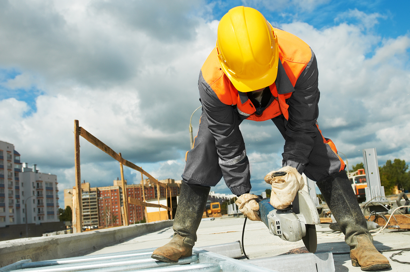 Builder worker with grinder machin